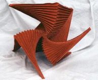 Abstract red origami sculpture on display.